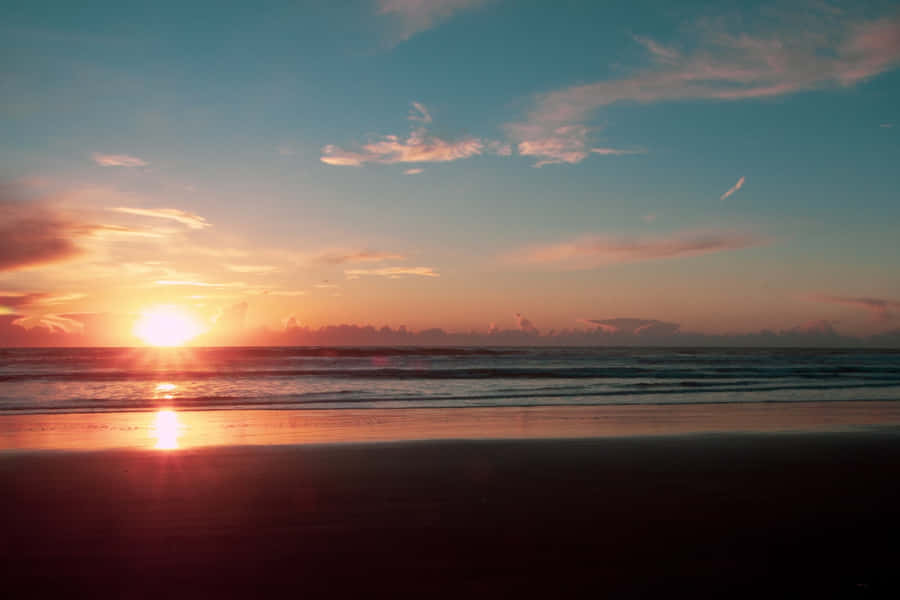 Enjoy A Peaceful View Of A Beautiful Sunset Wallpaper