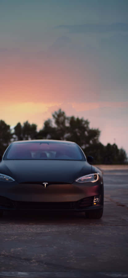 Enjoy A Wireless World With The Tesla Iphone. Wallpaper