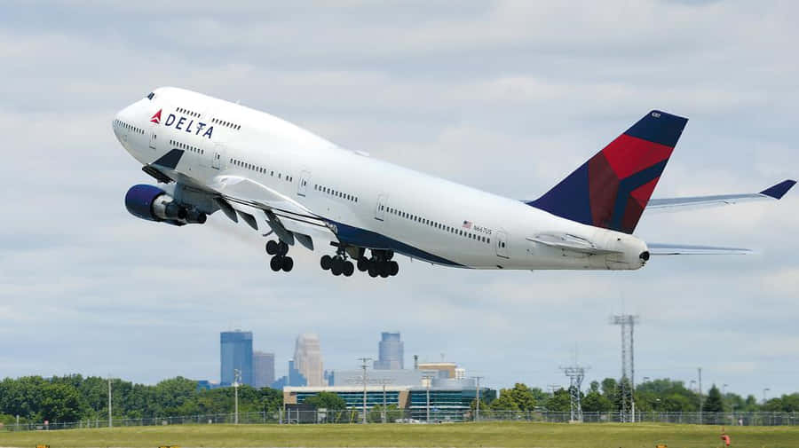 Enjoy The Panoramic View Of A Jumbo Jet Wallpaper