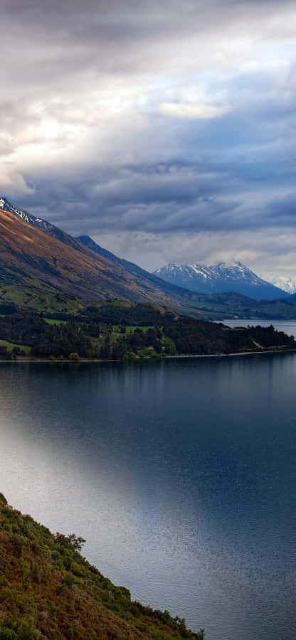 Enjoy The Peaceful Beauty Of Nature In One Of The Most Beautiful Mountain Lakes In The World. Wallpaper