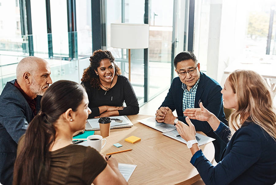 Enterprise Employees In A Business Meeting Wallpaper