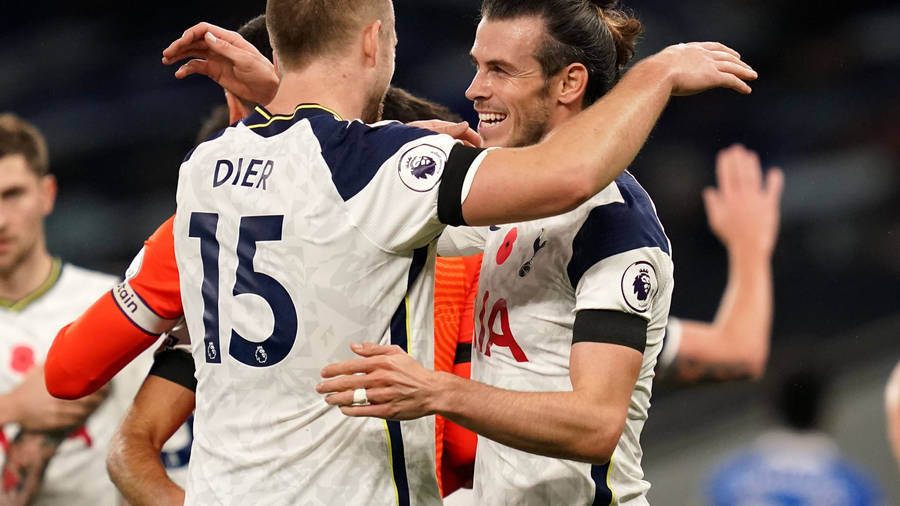 Eric Dier Hugging Teammate Wallpaper