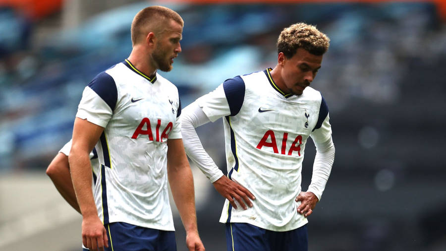 Eric Dier Walking With Teammate Wallpaper