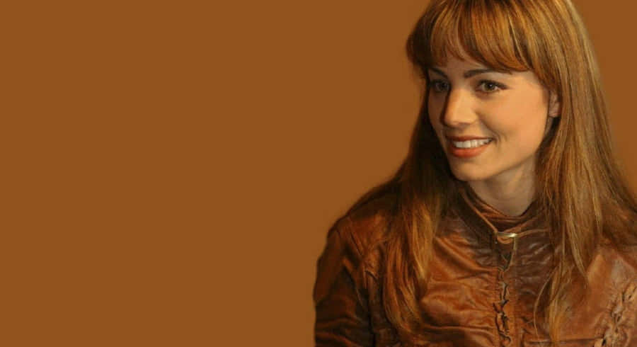 Erica Durance Smilingin Brown Leather Jacket Wallpaper