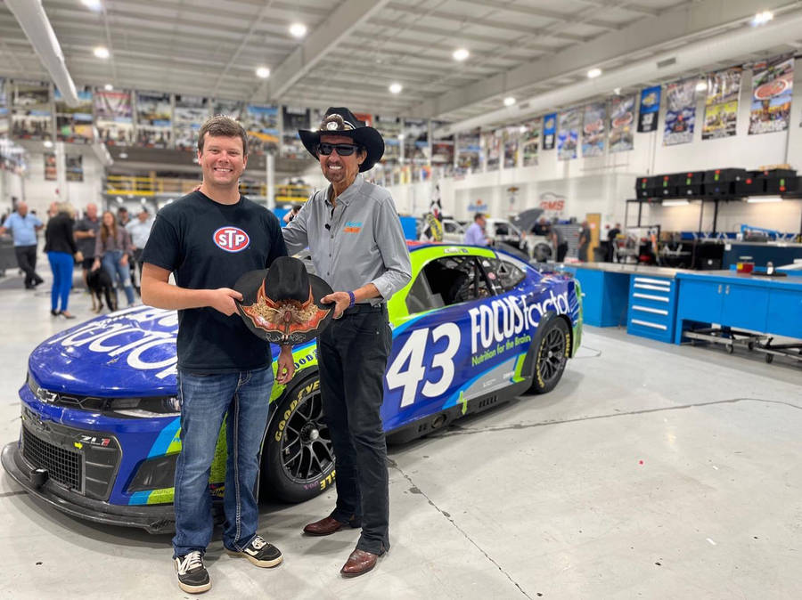 Erik Jones With A Man With Cowboy Hat Wallpaper