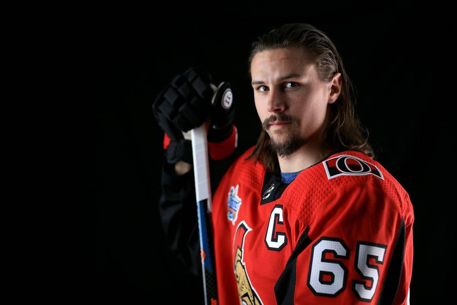 Erik Karlsson In Action On The Hockey Rink Wallpaper