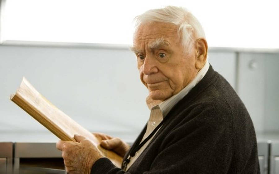 Ernest Borgnine Holding A Book Wallpaper