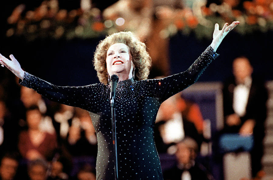 Ethel Merman Singing On Stage In Black Wallpaper