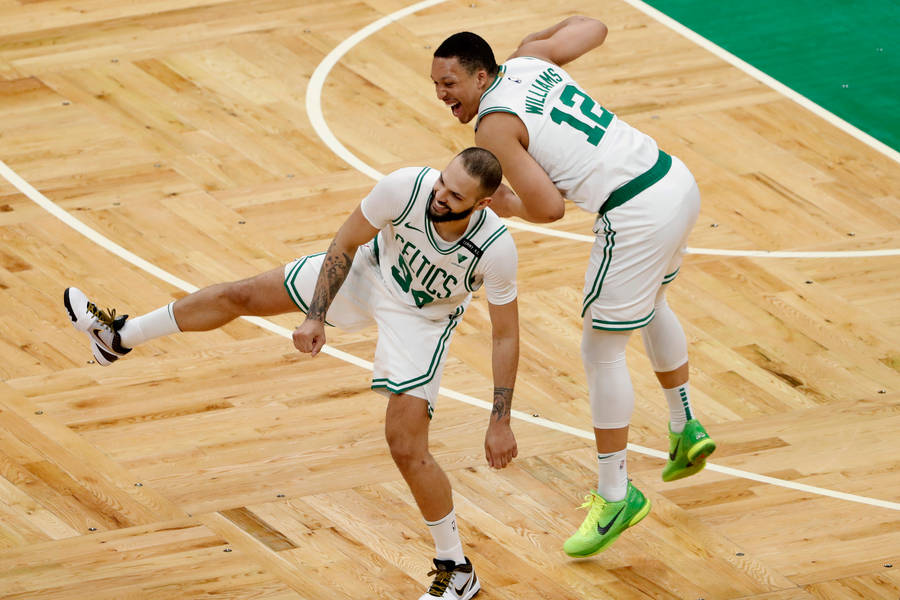 Evan Fournier And Grant Williams Wacky Jump Wallpaper