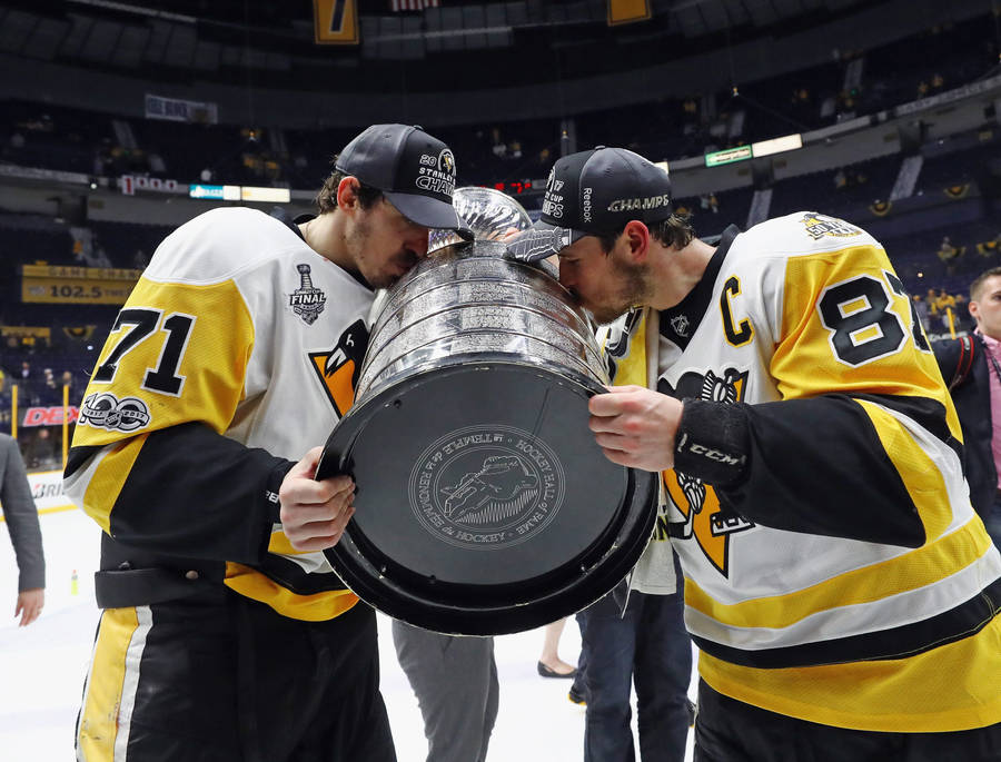 Evgeni Malkin Kissing Stanley Cup Trophy Wallpaper