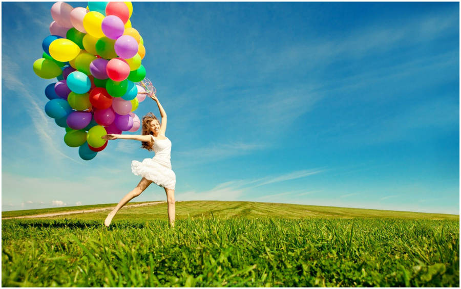 Excited Girl In A Field Wallpaper