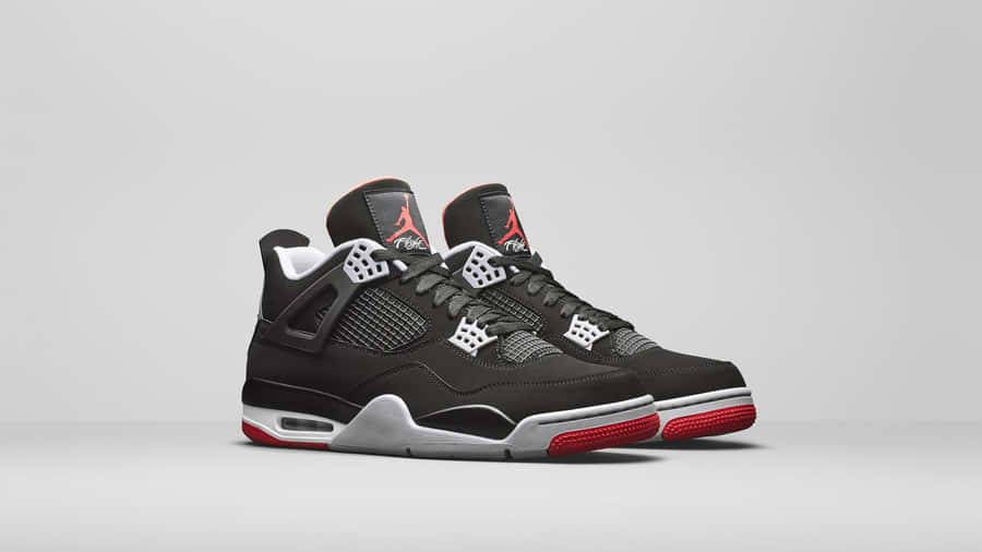 Explore Flight With The Air Jordan 4s Wallpaper