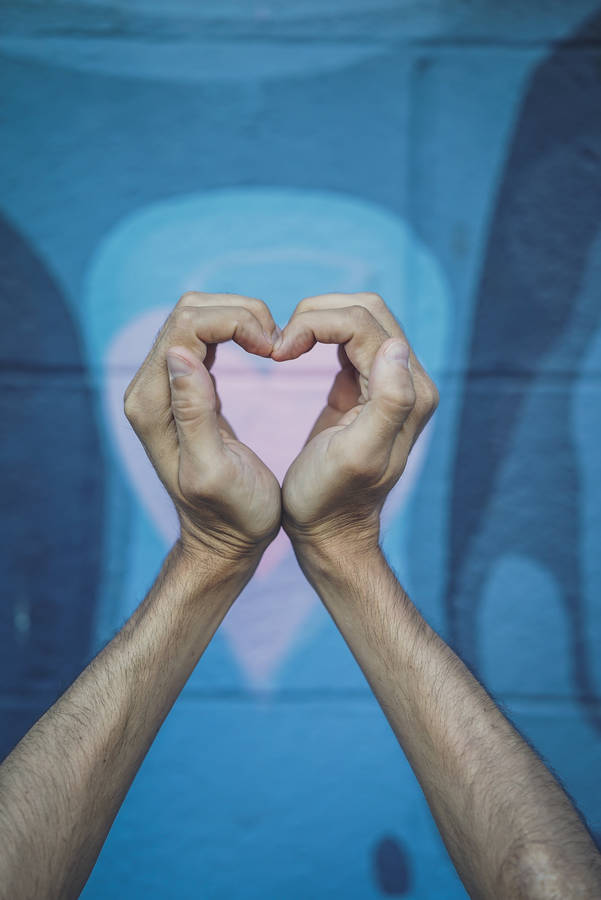 Expressing Love With A Finger Heart Reflection In The Mirror Wallpaper