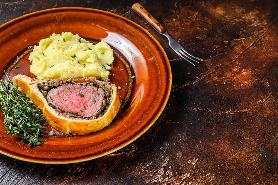 Exquisite Beef Wellington On A Combination Plate Wallpaper