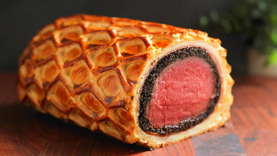 Exquisite Beef Wellington With A Dark Aesthetic Wallpaper