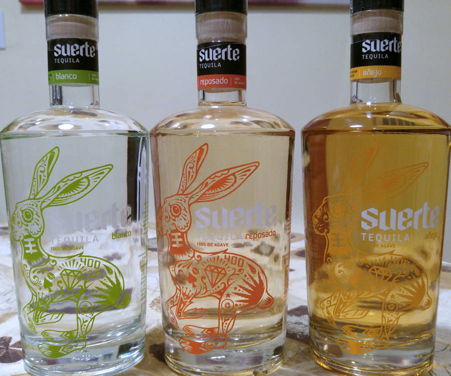 Exquisite Collection Of Suerte Tequila Bottles Wallpaper