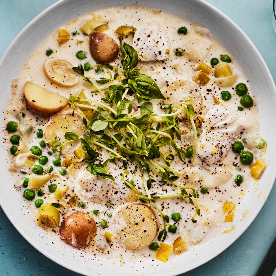 Exquisite Fish Chowder Garnished With Fresh Peas Wallpaper