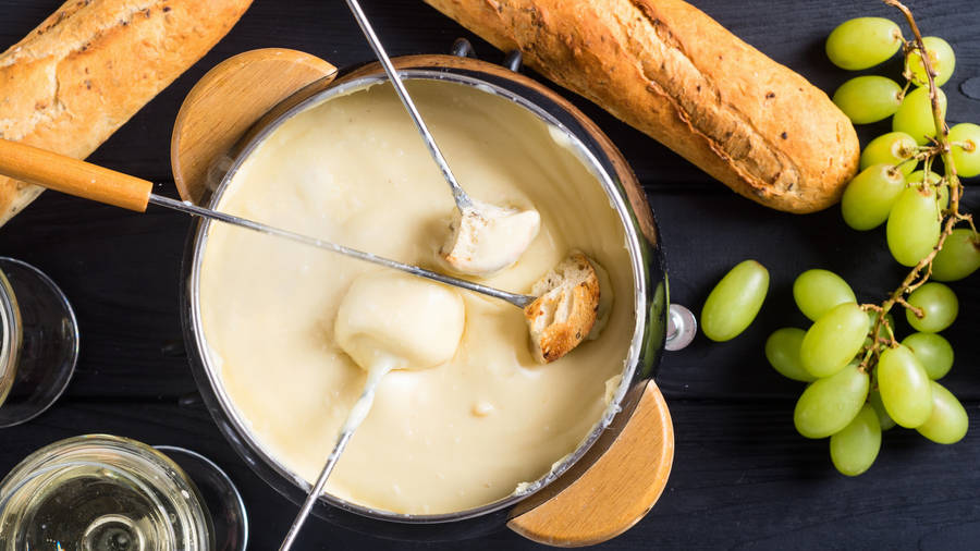 Exquisite Fondue With Fresh French Baguette Wallpaper