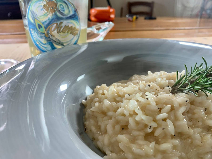 Exquisite Risotto With Fresh Rosemary And Pepper Wallpaper