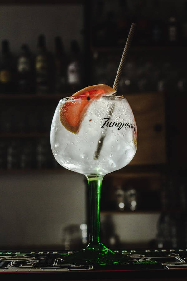 Exquisite Tanqueray Gin In A Goblet Glass Wallpaper