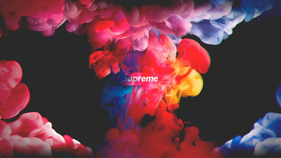 Eye-catching Supreme Laptop With Colored Smoke Background. Wallpaper