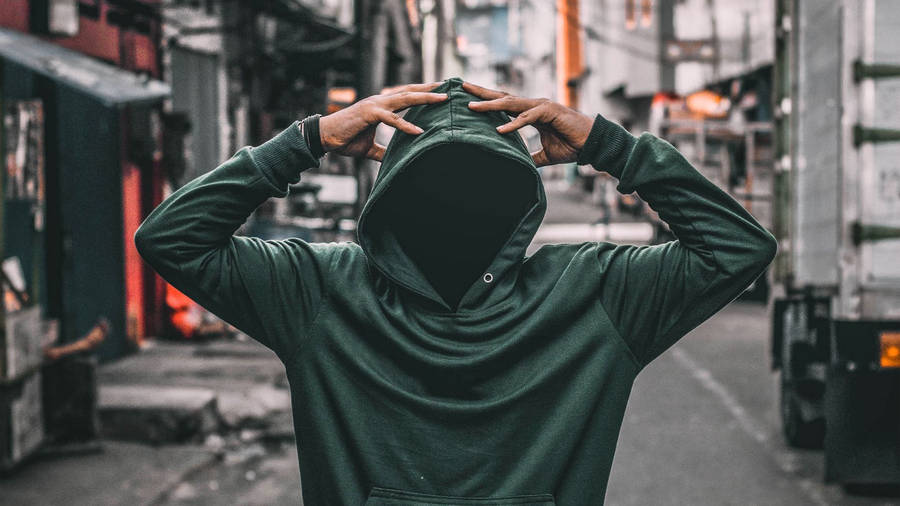 Fashion-forward Green Hoodie On City Streets Wallpaper