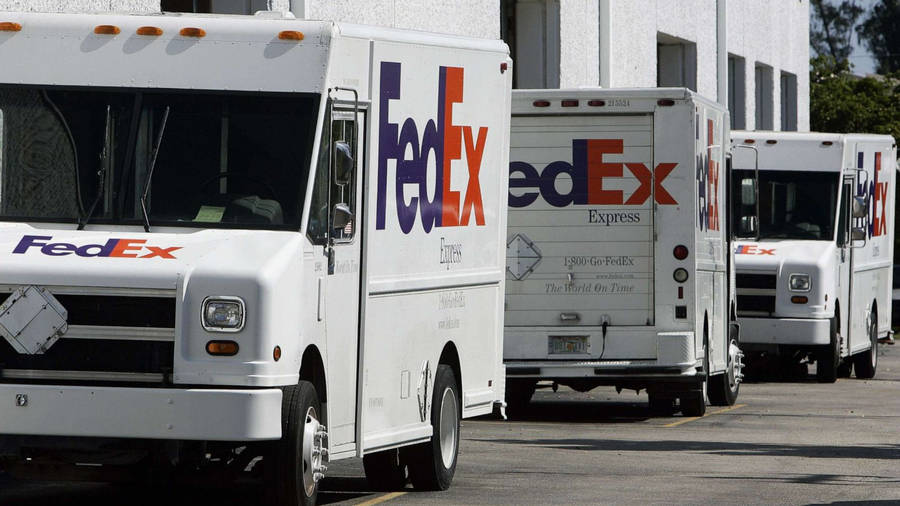 Fedex Tracking Vehicles Parked Wallpaper