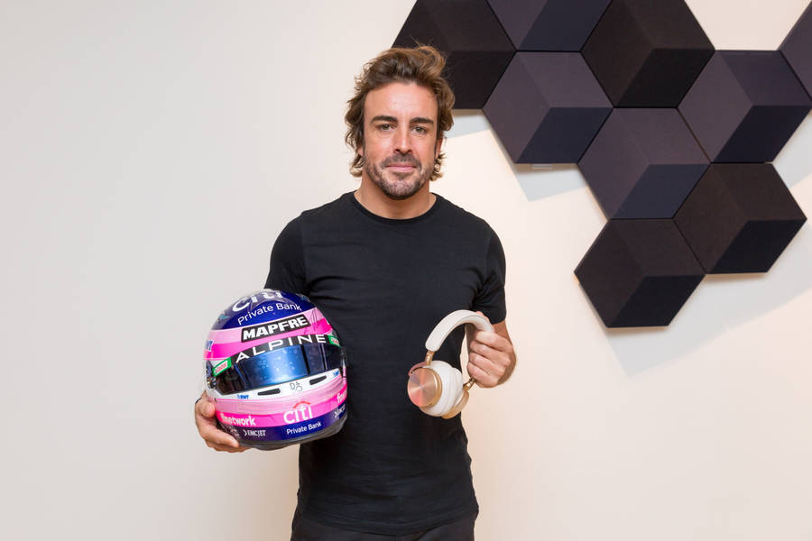 Fernando Alonso With Helmet And Headphones Wallpaper