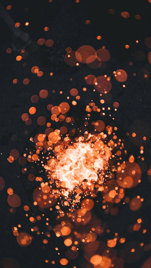 Fiery Bokeh With Black Background Wallpaper