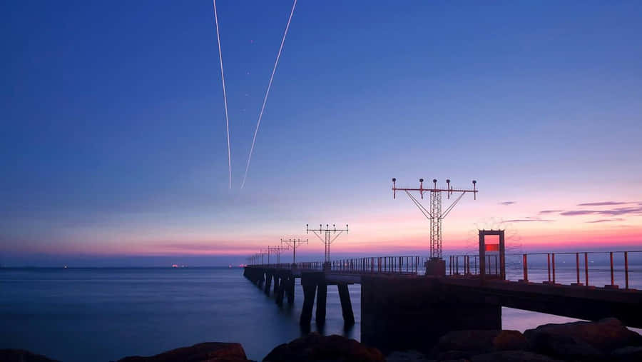 Find Yourself Beneath An Endless Sky At The Beautiful Hd Beach. Wallpaper