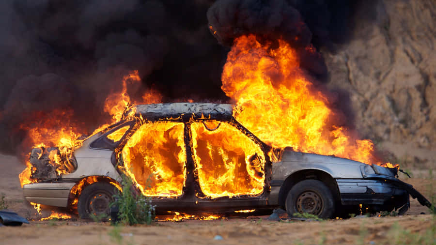 Fire Fighters Bravely Using Their Fire Cars To Put Out A Fire Wallpaper