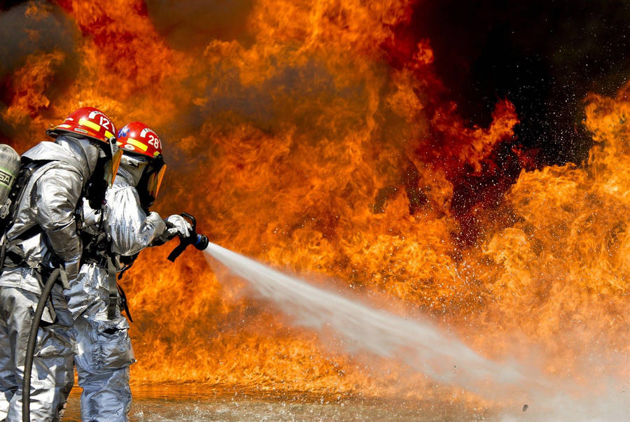 Firefighters In Red Helmet Wallpaper