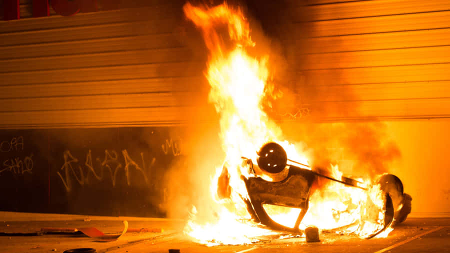 Firefighters Put Out An Intense Car Fire Wallpaper