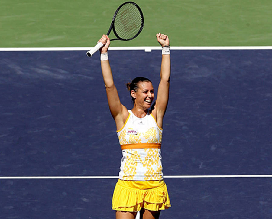 Flavia Pennetta Holding Racket Up Wallpaper