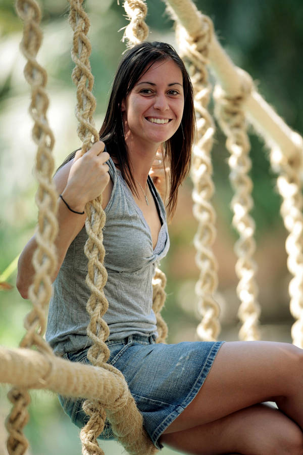 Flavia Pennetta Sitting On Swing Wallpaper