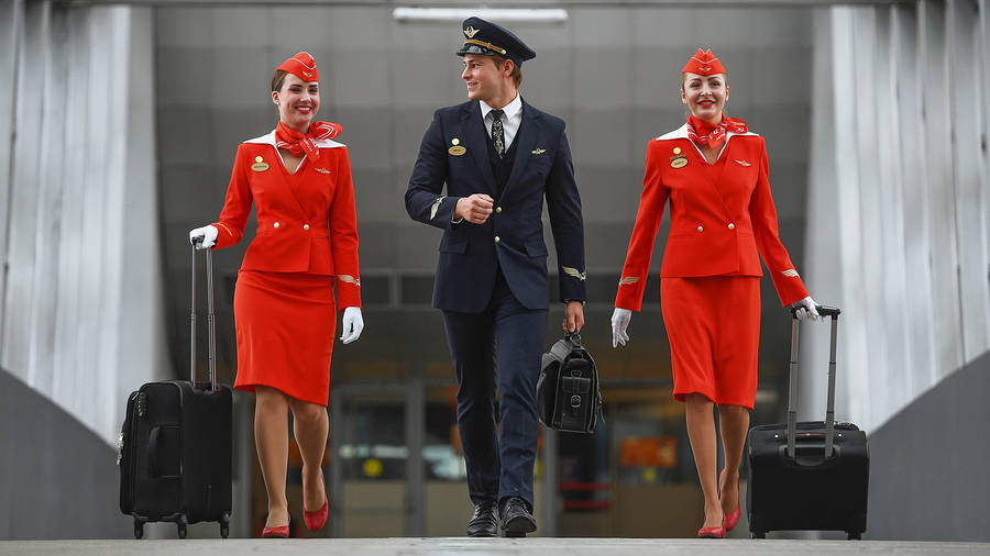 Flight Attendants With Pilot Wallpaper