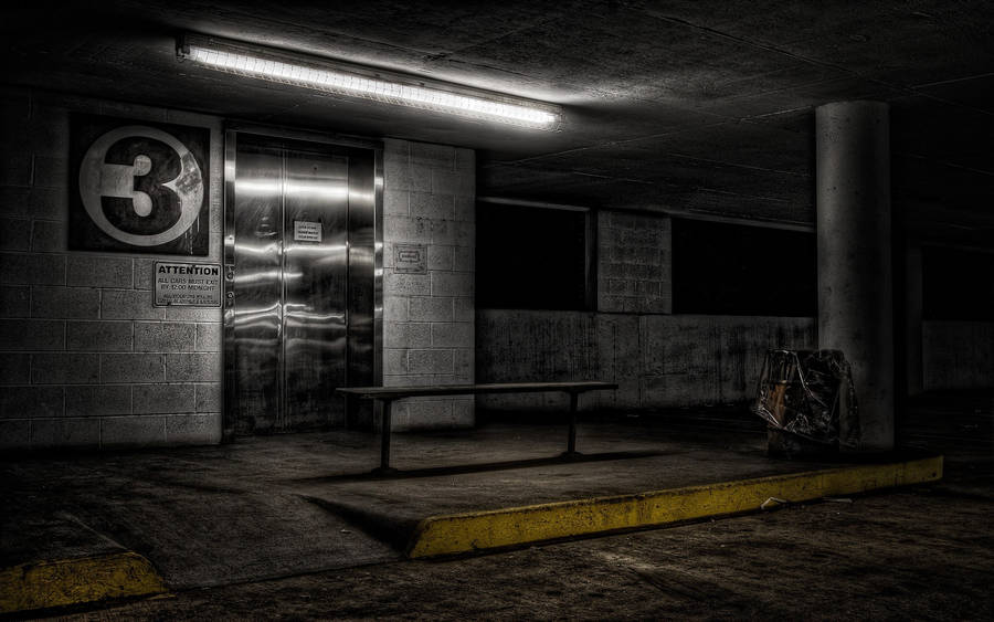 Flight Of Stairs In Illuminated Underground Parking Wallpaper