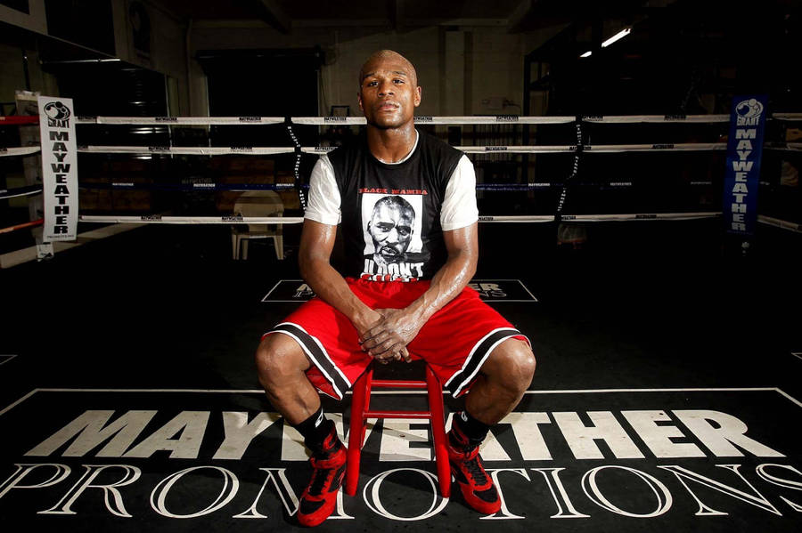 Floyd Mayweather Sitting On Red Chair Wallpaper