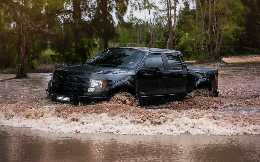 Ford Raptor Crossing A Muddy Flood Wallpaper