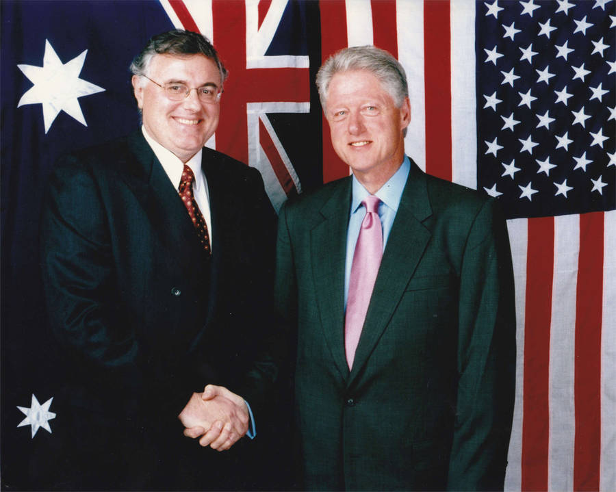 Former President Bill Clinton In A Green Suit Wallpaper