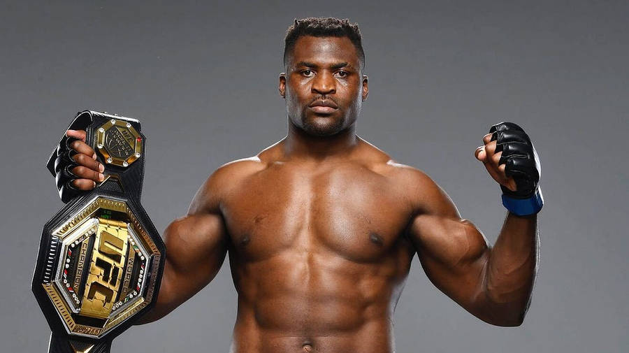 Francis Ngannou Holding Championship Belt Wallpaper