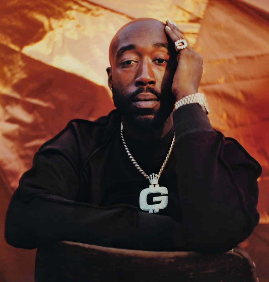 Freddie Gibbs Portraitwith Gold Chain Wallpaper