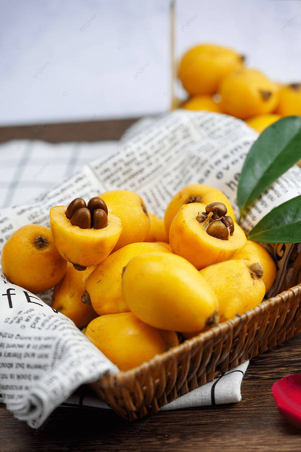 Fresh And Ripened Loquat Fruits Basket Wallpaper