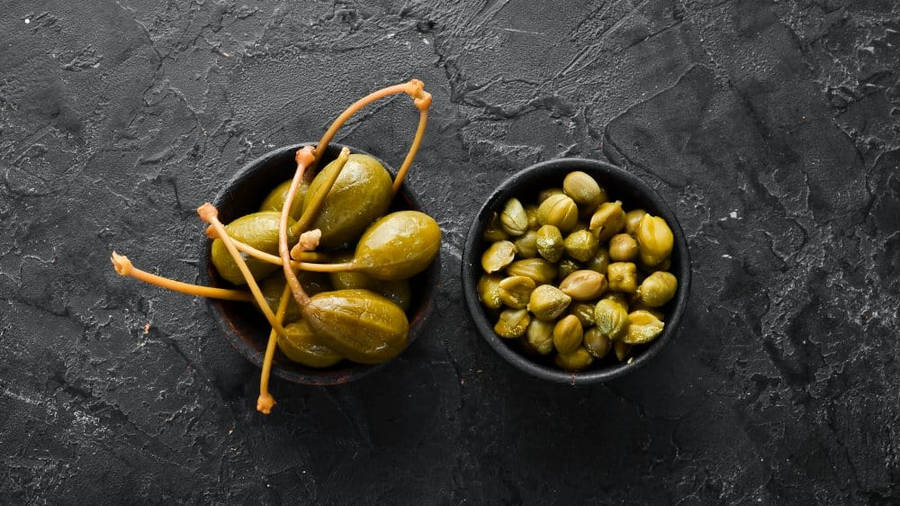 Fresh And Tasty Capers In A Bowl Wallpaper