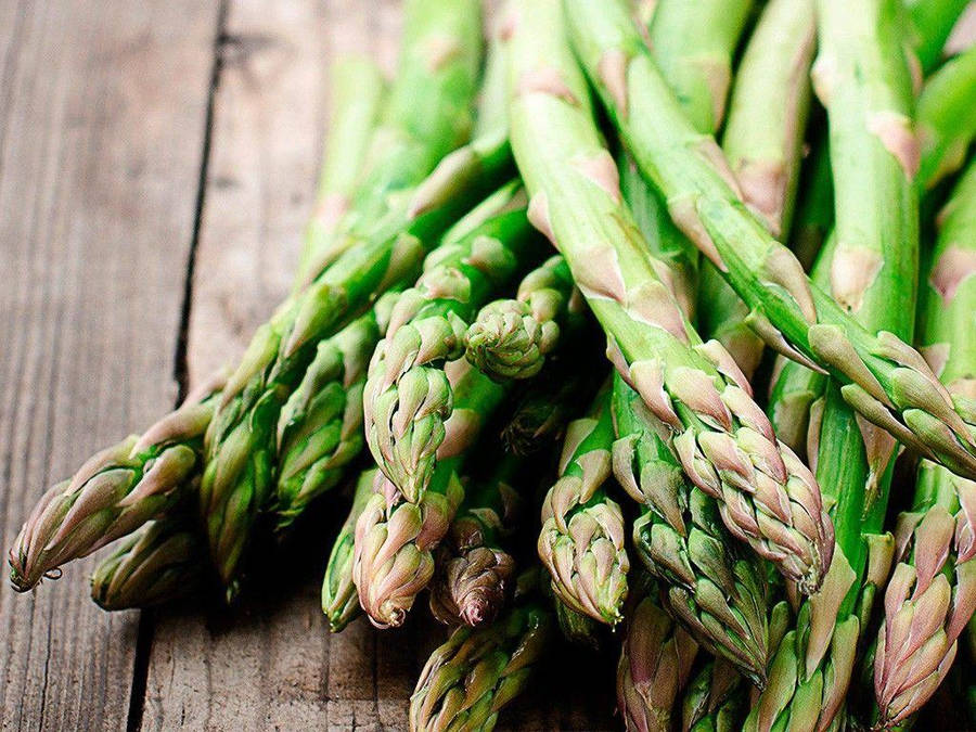 Fresh Asparagus With Pointy Brown Leaves Wallpaper