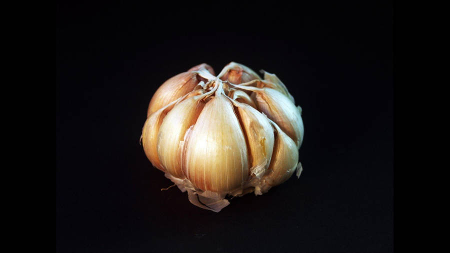 Fresh Garlic Cloves On A Dark Background Wallpaper