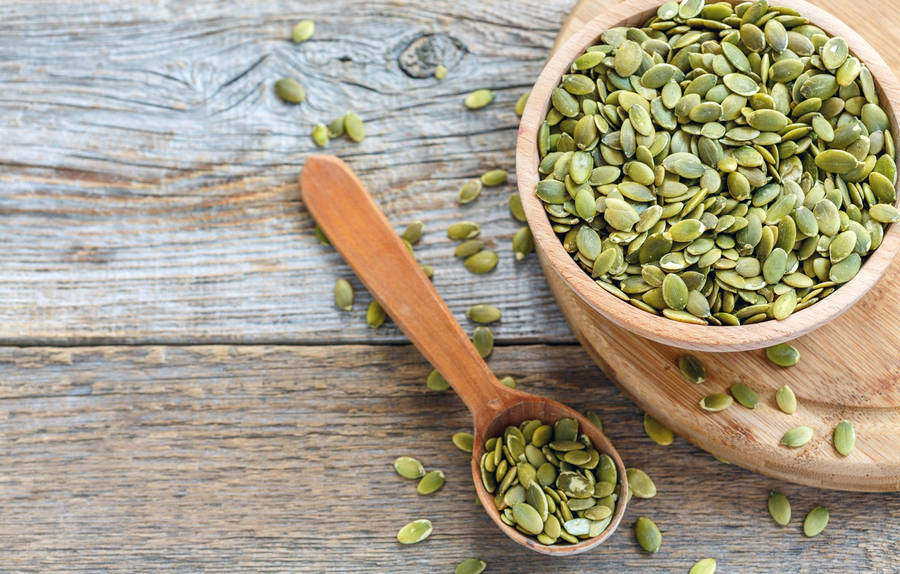 Fresh Green Lentils In Wooden Bowl And Spoon Wallpaper