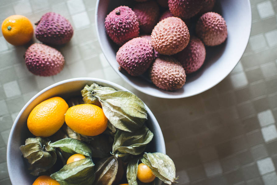 Fresh Kumquat And Lychee Fruits Flat Lay Wallpaper