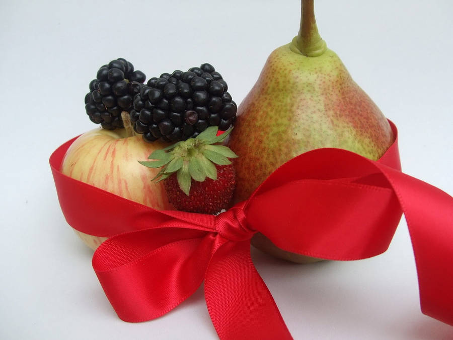 Fresh Mulberry Fruits Adorned With A Red Ribbon Wallpaper