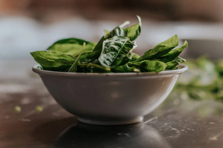 Fresh Spinach In A Ceramic Bowl Wallpaper